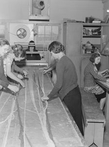 In the sewing room, Shafter camp for migrants (FSA,) California, 1938. Creator: Dorothea Lange