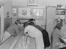 In the sewing room, Shafter camp for migrants (FSA), California, 1938. Creator: Dorothea Lange