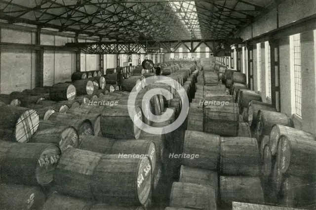 "In the Warehouses of the P.L.A. with their Accommodation for a Million Tons" -Tobacco...', 1937. Creator: Unknown.