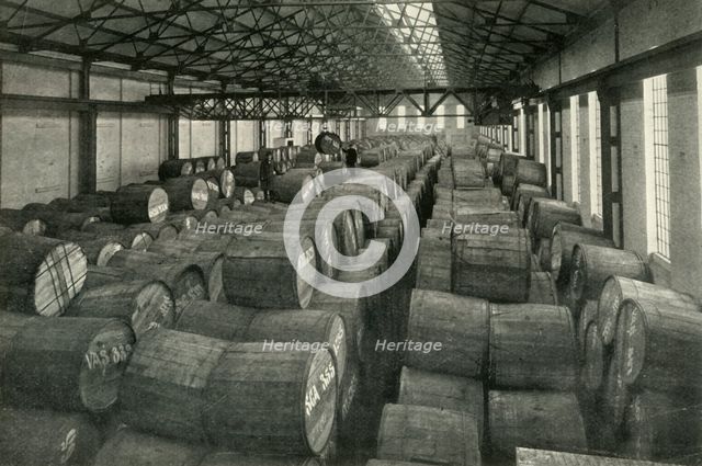 "In the Warehouses of the P.L.A. with their Accommodation for a Million Tons" -Tobacco...', 1937. Creator: Unknown.
