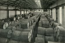 "In the Warehouses of the P.L.A. with their Accommodation for a Million Tons" -Tobacco... 1937. Creator: Unknown