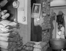 Interior of a Chinese laundry located under the apartment of..., Washington, D.C., 1942. Creator: Gordon Parks