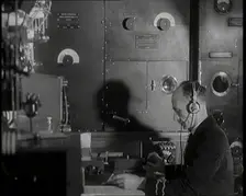 Interior of a Ship at Sea With Man at Work Operating a Communication System, 1920s. Creator: British Pathe Ltd