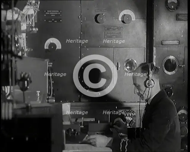 Interior of a Ship at Sea With Man at Work Operating a Communication System, 1920s. Creator: British Pathe Ltd.