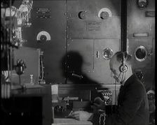 Interior of a Ship at Sea With Man at Work Operating a Communication System, 1920s. Creator: British Pathe Ltd