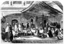 Interior of a Sikh Temple at Umritzir - reading the Grunt'h, 1858. Creator: Unknown