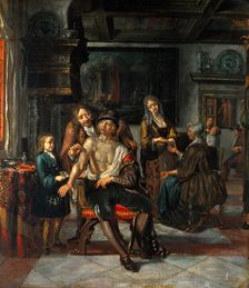 Interior of a surgery with a surgeon treating a wound in the arm of a man, with a boy and..., 1700s. Creator: Matthys Naiveu