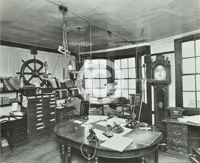 Interior of an office with a man on the telephone, Greenwich, London, November 1936. Artist: Unknown.
