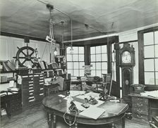 Interior of an office with a man on the telephone, Greenwich, London, November 1936