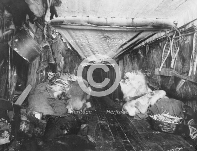 Interior of Eskimo hut, 1916. Creator: Lomen Brothers.