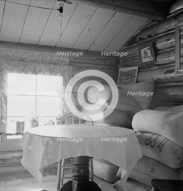 Interior of farmer's two-room log home, FSA borrower, Boundary County, Idaho, 1939. Creator: Dorothea Lange.