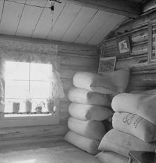 Interior of farmer's two-room log home, FSA borrower, Boundary County, Idaho, 1939. Creator: Dorothea Lange