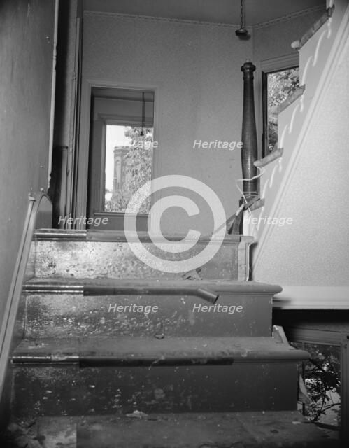 Interior of wrecked houses on Independence Avenue, Washington, D.C, 1942. Creator: Gordon Parks.