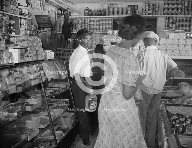 Interior of the grocery store patronized by Mrs. Ella Watson..., Washington, D.C., 1942. Creator: Gordon Parks.
