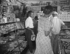 Interior of the grocery store patronized by Mrs. Ella Watson..., Washington, D.C., 1942. Creator: Gordon Parks