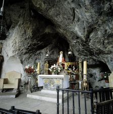 Interior of the Holy Cave of Covadonga with the image of the Virgin
