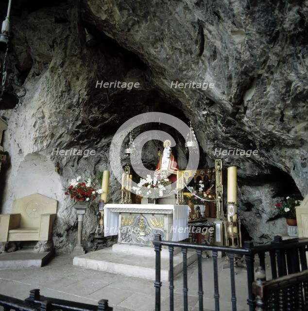 Interior of the Holy Cave of Covadonga with the image of the Virgin.