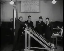 Interior Shot of a British Man Inserting Various Items in a Long Thin Glass Time Capsule..., 1938. Creator: British Pathe Ltd