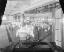 Interior shot of dining room, possibly the Royal Yacht Squadron, Cowes. Creator: Kirk & Sons of Cowes