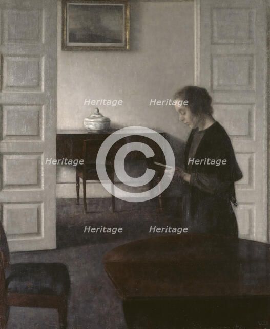 Interior with a Reading Lady, 1900. Creator: Vilhelm Hammershoi.