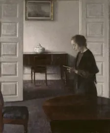 Interior with a Reading Lady, 1900. Creator: Vilhelm Hammershoi