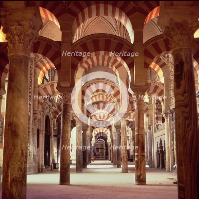 Interior view with columns of marble, jasper and granite in the Mosque of Cordoba.