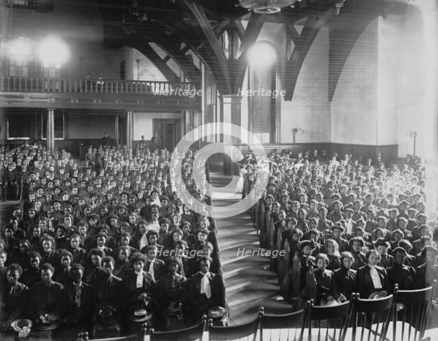 Interior view of chapel filled with female students at the Tuskegee Institute, c1902. Creator: Frances Benjamin Johnston.