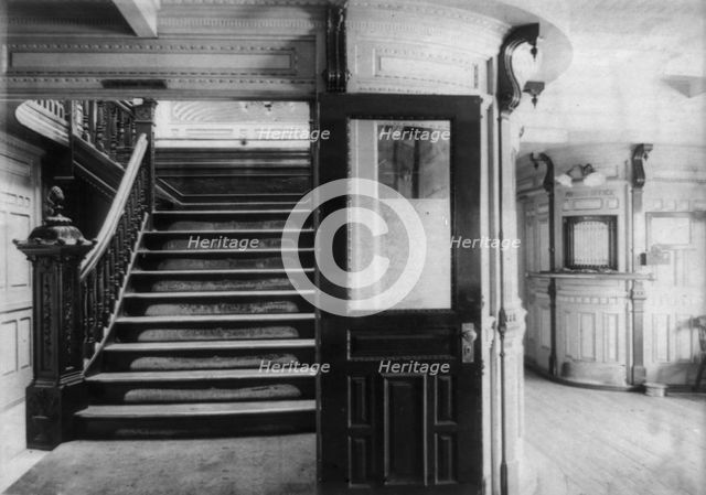 Interior view of steamboat showing stairway and pursers office, c1900. Creator: Frances Benjamin Johnston.