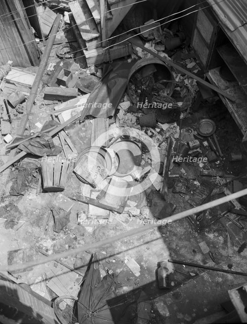 Interiors of wrecked homes on Independence Avenue..., Washington, D.C, 1942. Creator: Gordon Parks.