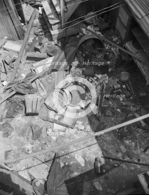 Interiors of wrecked homes on Independence Avenue..., Washington, D.C, 1942. Creator: Gordon Parks.