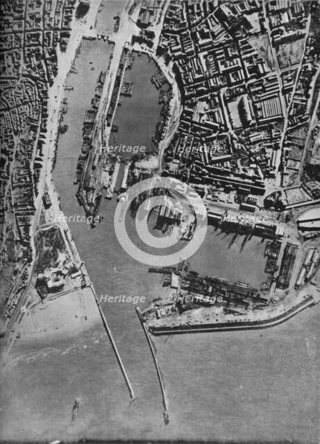 Invasion barges massed in Boulogne harbour, France, 1940 (1943).  Artist: Unknown.