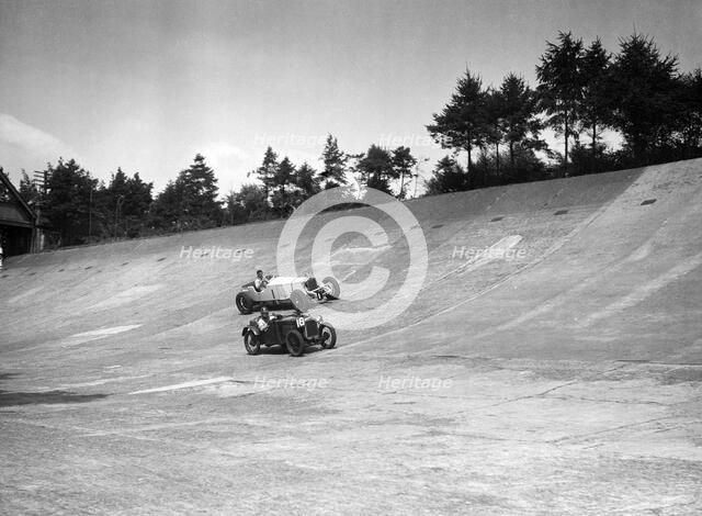 Invicta and Austin Ulster racing on the Members Banking at Brooklands. Artist: Bill Brunell.
