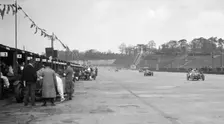 Invicta leading a Riley 9 Brooklands in the JCC Double Twelve race, Brooklands, 8/9 May 1931. Artist: Bill Brunell