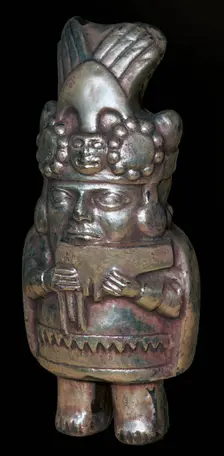 Incan silver figure of a man with pan-pipes