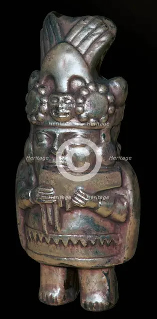 Incan silver figure of a man with pan-pipes. Artist: Unknown