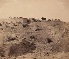 India: the ruins of Sammy House surrounded by scattered bones of sepoys killed in action, c1858. Creator: Felice Beato