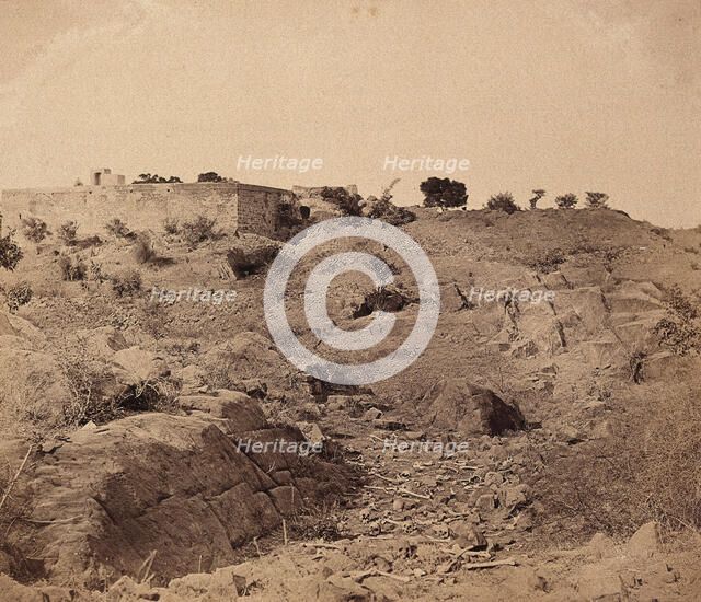 India: the ruins of Sammy House surrounded by scattered bones of sepoys killed in action, c1858. Creator: Felice Beato.