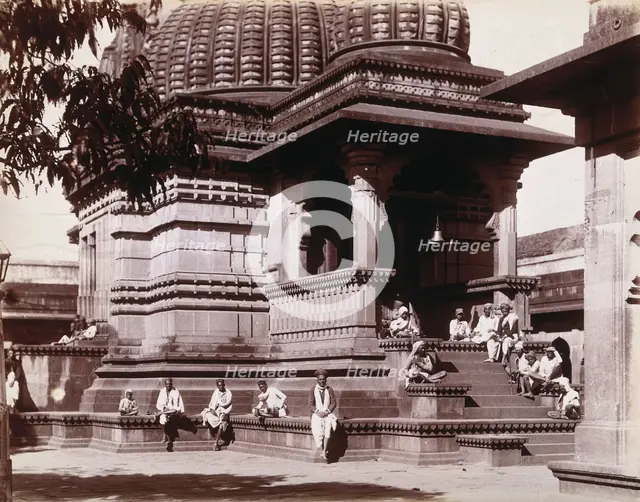 Indian men sitting on steps outside a domed building in Bombay during an outbreak of plague, 1896/7. Creator: Unknown.
