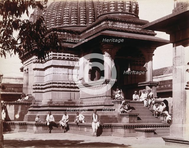 Indian men sitting on steps outside a domed building in Bombay during an outbreak of plague, 1896/7. Creator: Unknown.