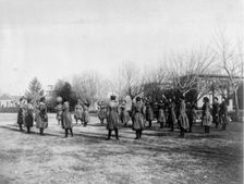 Indian and black girls exercising with medicine ball, Hampton Institute, 1899 or 1900. Creator: Frances Benjamin Johnston