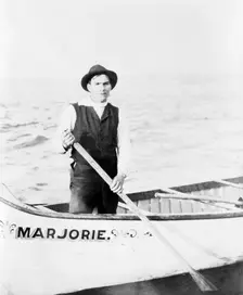 Indian guide for the rapids, standing in canoe, in the Sault Sainte Marie region of Michigan, 1903. Creator: Frances Benjamin Johnston
