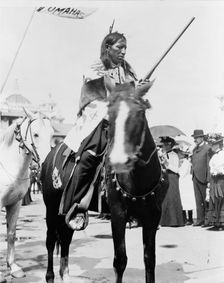 Indian, holding gun, on horse, at the Pan-American Exposition, Buffalo, New York, 1901. Creator: Frances Benjamin Johnston