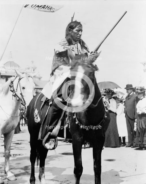 Indian, holding gun, on horse, at the Pan-American Exposition, Buffalo, New York, 1901. Creator: Frances Benjamin Johnston.