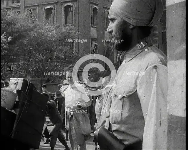 Indian Soldier in the International Settlement in Shanghai With Civilian..., 1937 Creator: British Pathe Ltd.
