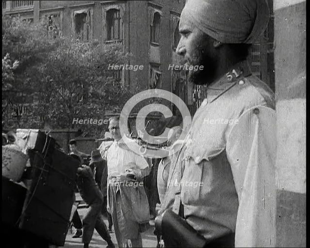 Indian Soldier in the International Settlement in Shanghai With Civilian..., 1937 Creator: British Pathe Ltd.