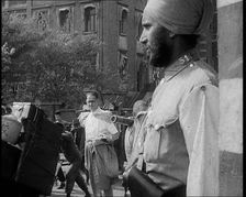Indian Soldier in the International Settlement in Shanghai With Civilian..., 1937 Creator: British Pathe Ltd