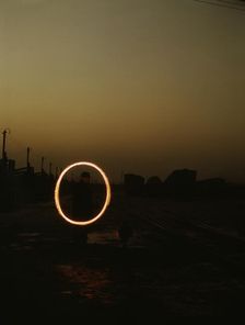 Indiana Harbor Belt RR, switchman demonstrating signal with a "fusee"..., 1943. Creator: Jack Delano