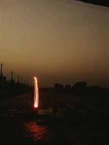 Indiana Harbor Belt RR, switchman demonstrating signal with a "fusee"..., 1943. Creator: Jack Delano