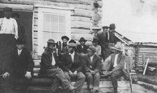 Indigenous peoples outside of log building, between c1900 and 1916. Creator: Unknown