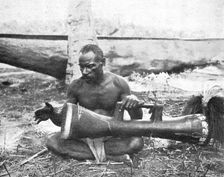 'Indigene (Musicien) de la nouvelle-Guinee britannique; Les Terres Du Pacifique 1914. Creator: Unknown